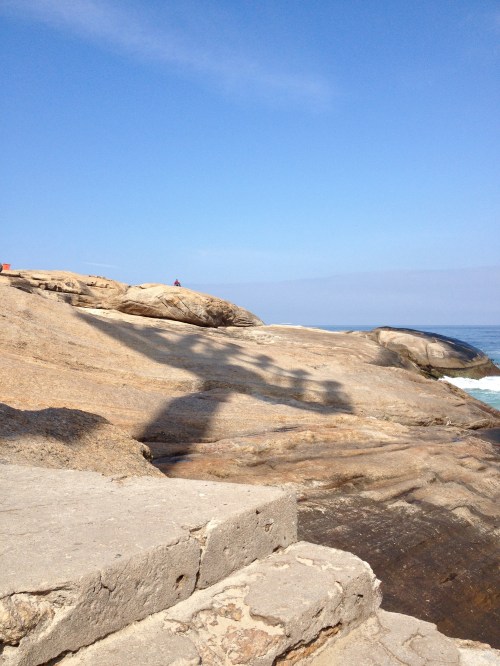 I sat on these big rocks and watched the surfers