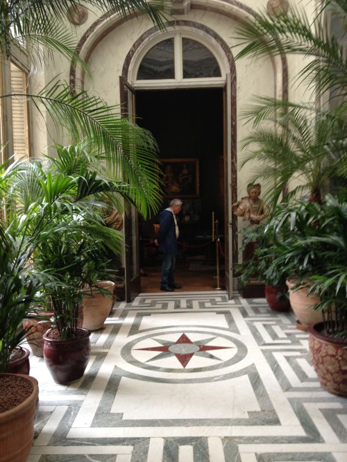 The man is standing in the entrance to the "smoking room", which is where the menfolk went to smoke their cigars and talk business after dinner.  I swear it still smelled of tobacco.