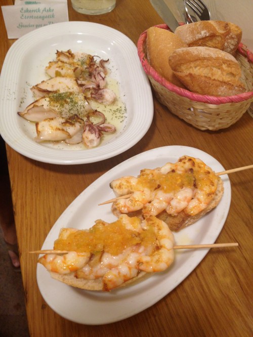 delicious garlic shrimp skewers and grilled octupus