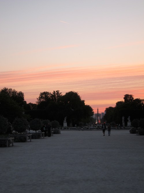 Looking straight down the middle of the Tuileries, as the obelisk slices through the Arc de Triomph.