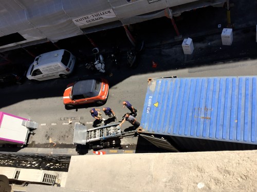 a crane was unloaded and set up behind the truck and under one of our windows